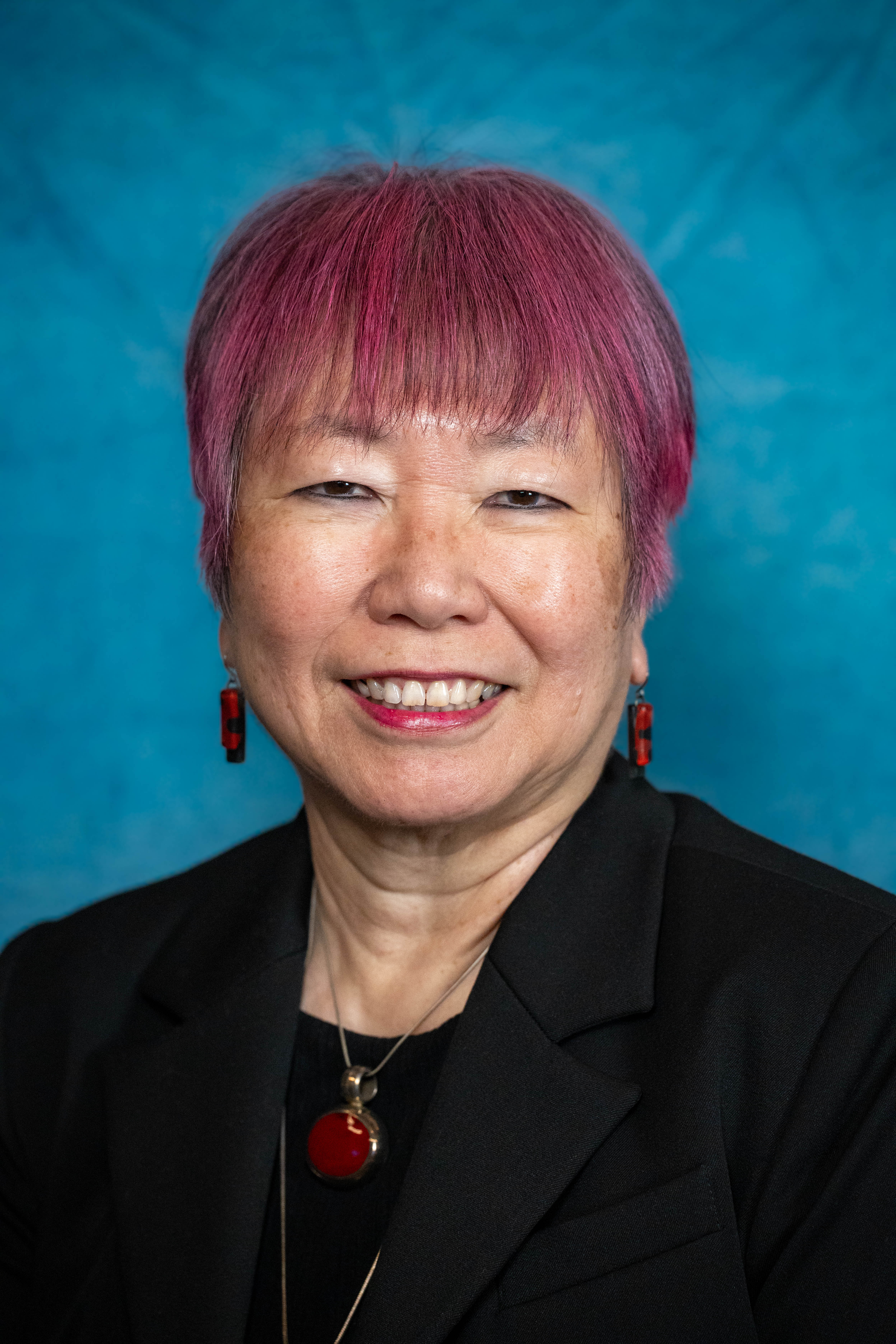 City council headshot — consistent blue backdrop